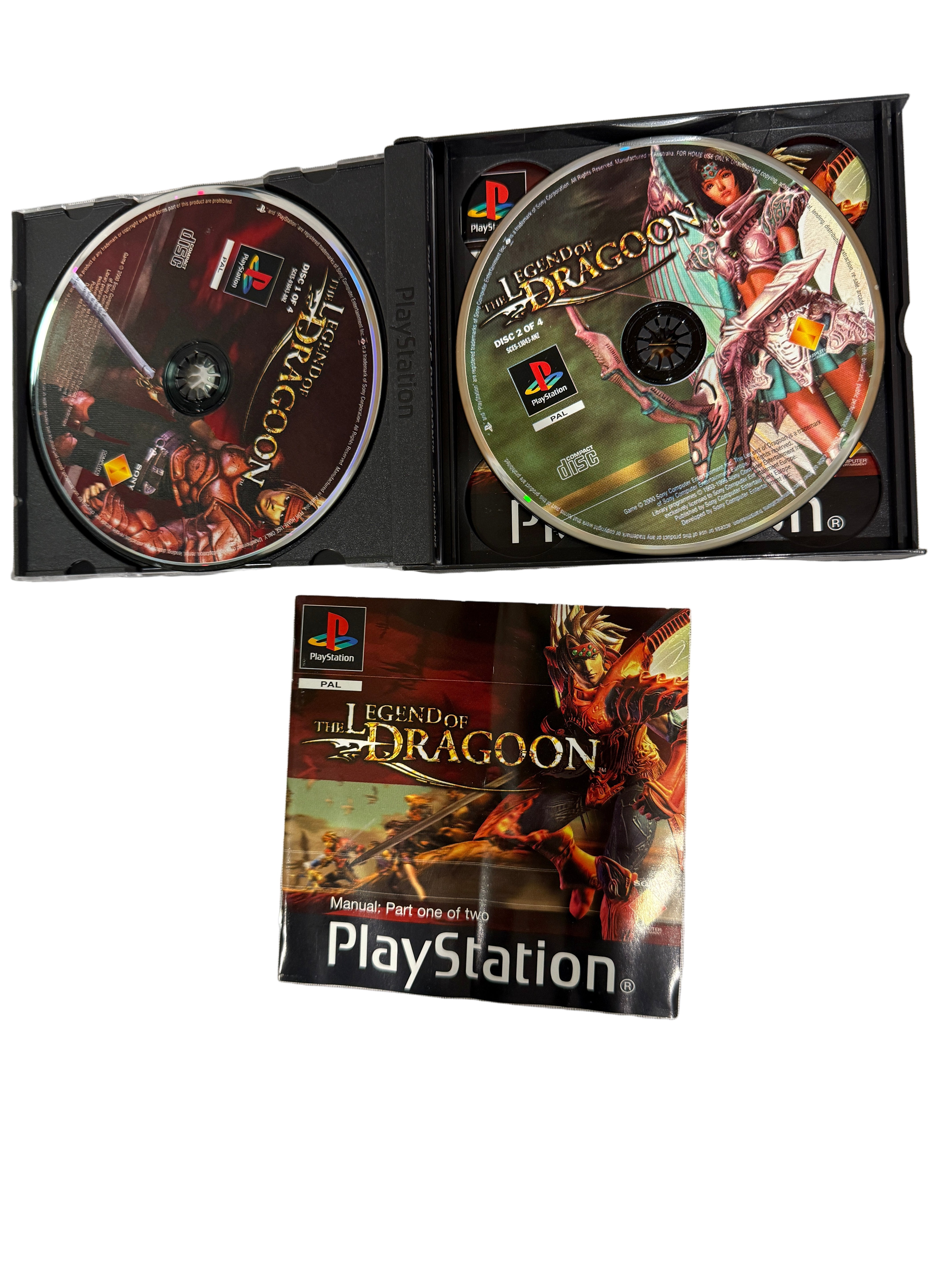 PlayStation game 'Legend of Dragoon' with two discs and a manual on a white surface.